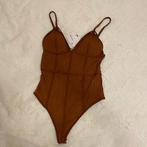 Burnt orange bodysuit with mesh panels